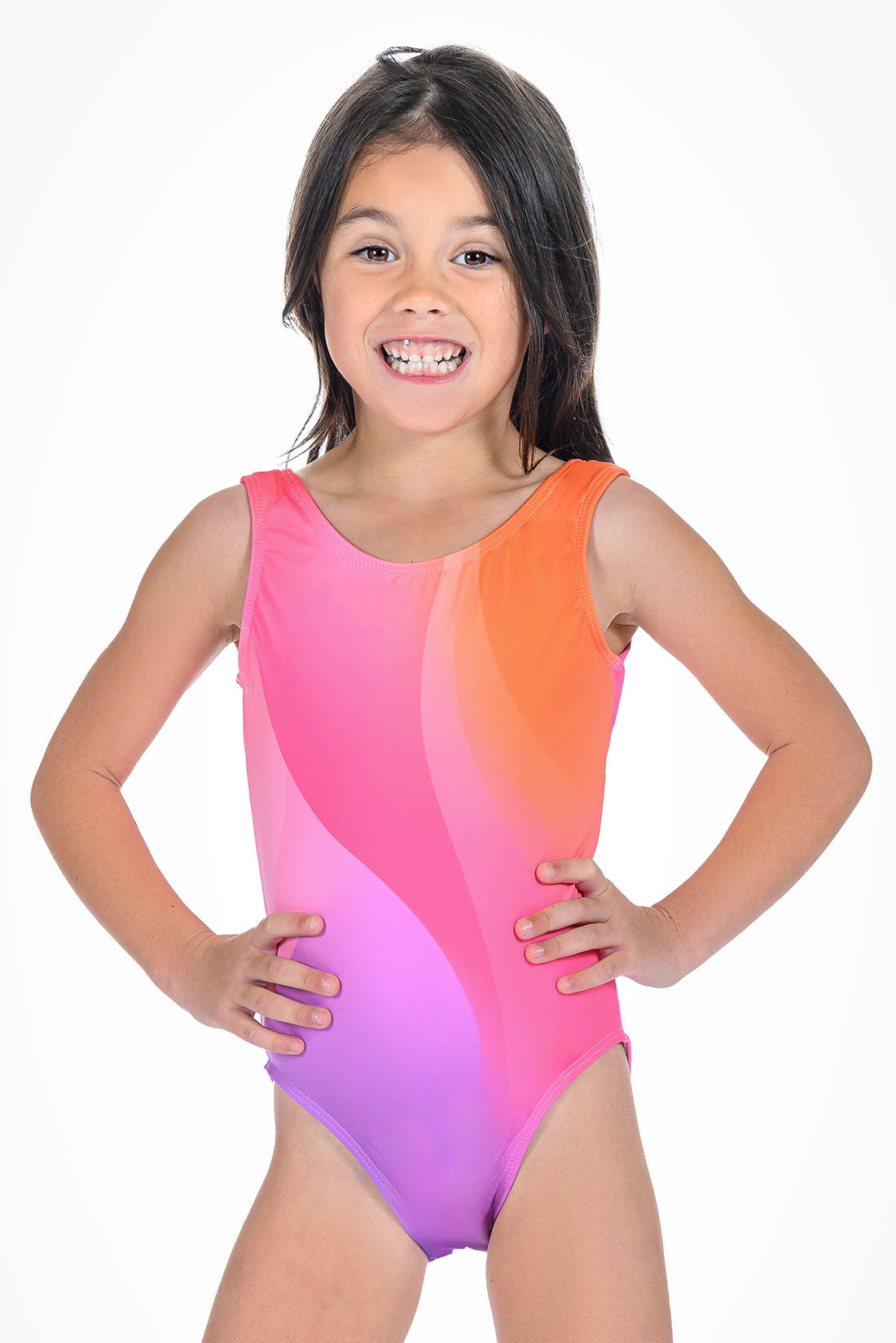 Young girl gymnast wearing a pink, orange, and purple geometric-patterned swimsuit