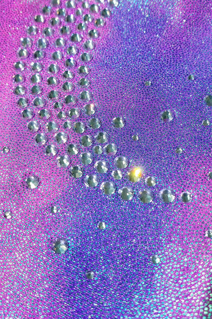 Close-up detail of a crystal moon embellishment on a sleeveless leotard by Destira, 2023