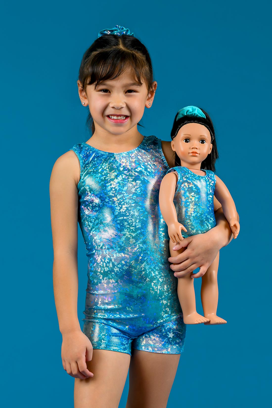 Matching blue doll leotard and gymnastics biketard by Destira, 2025