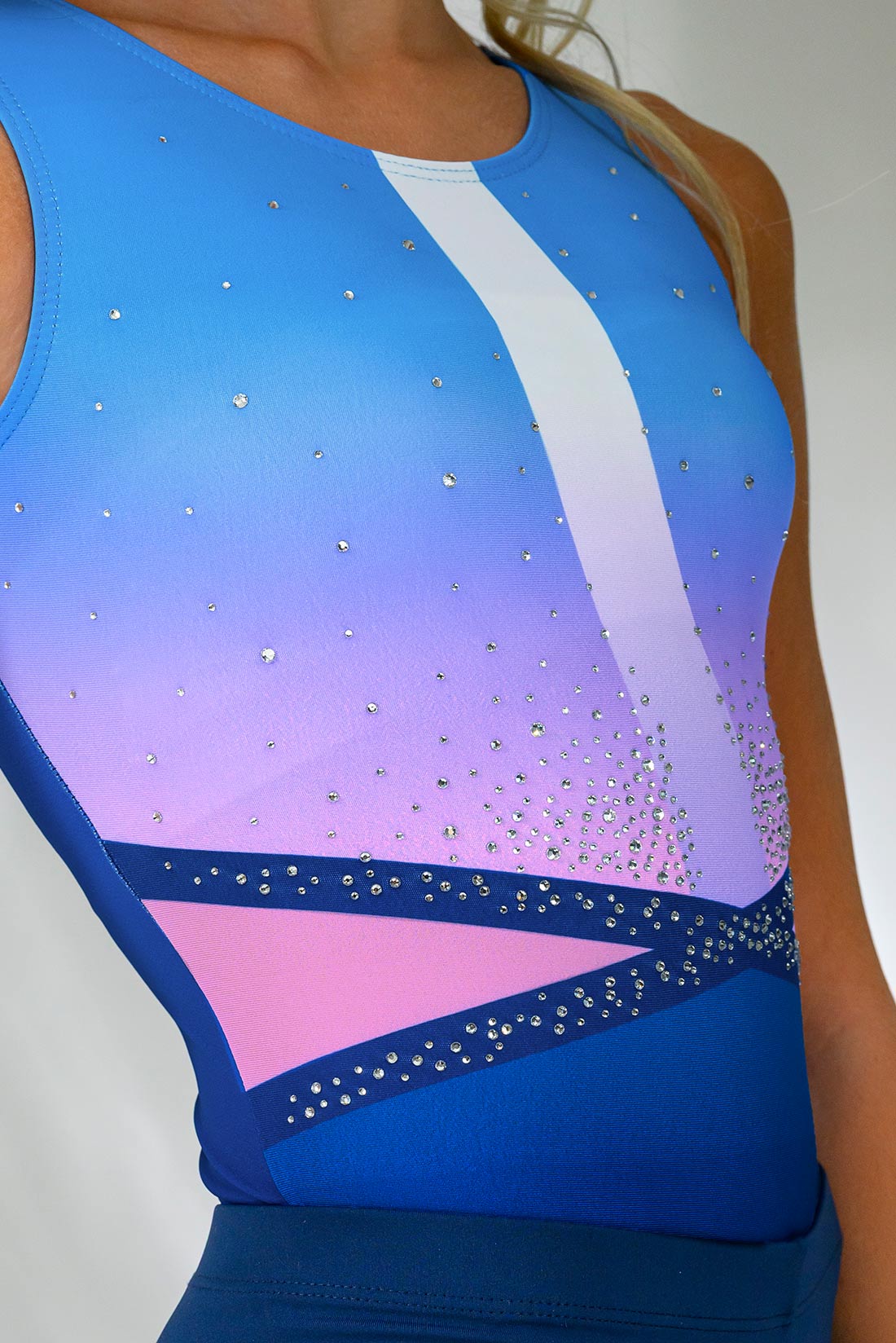 Rhinestone detail on blue and pink gymnastics leotard by Destira, 2025
