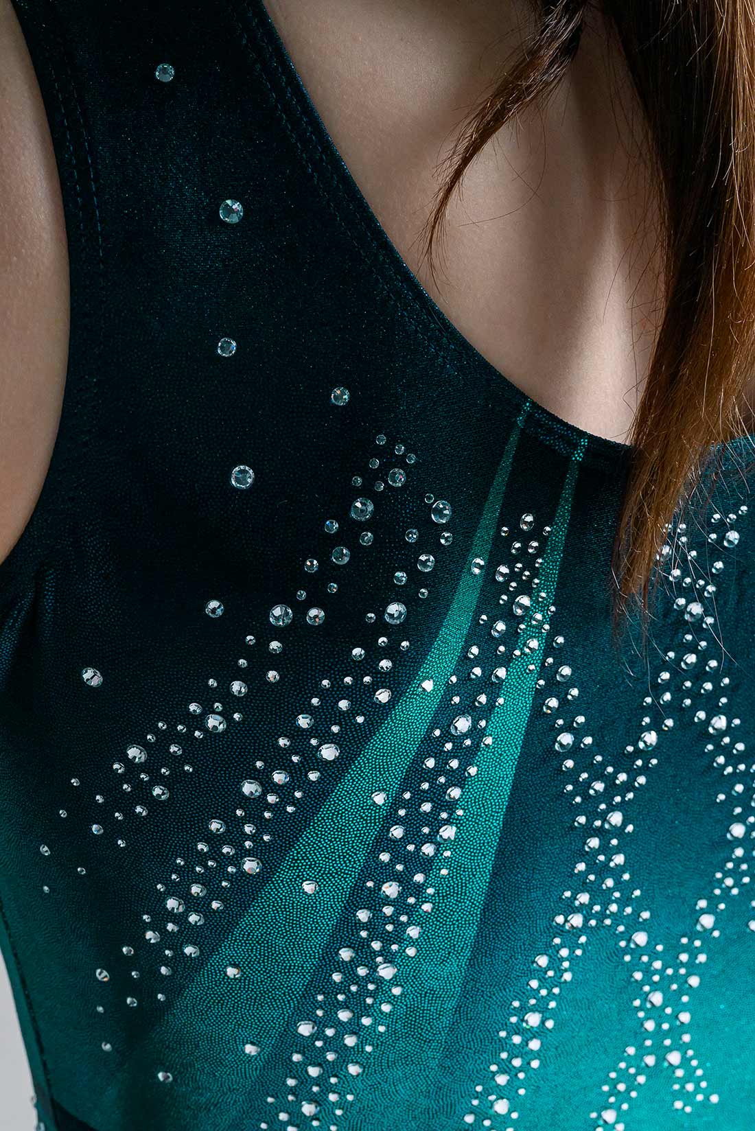 Rhinestones on teal green leotard for girls by Destira, 2025