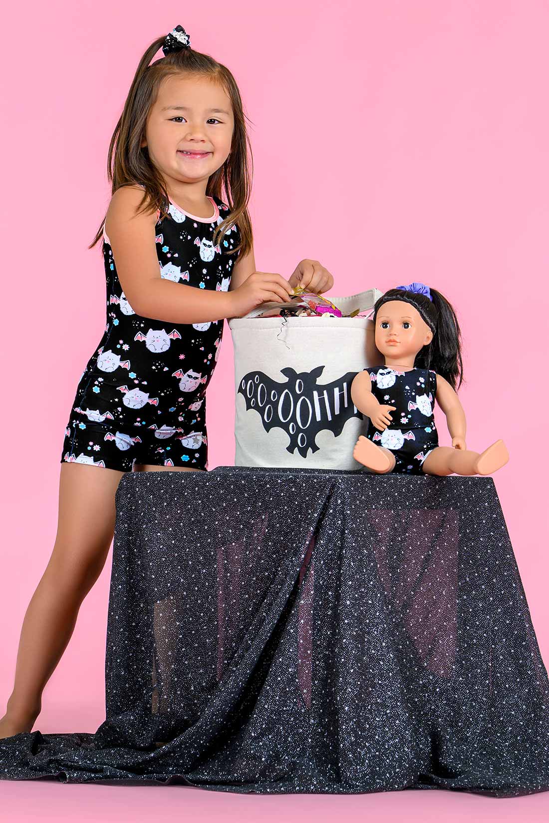 Girls Halloween gymnastics unitard featuring playful Meowloween cat design
