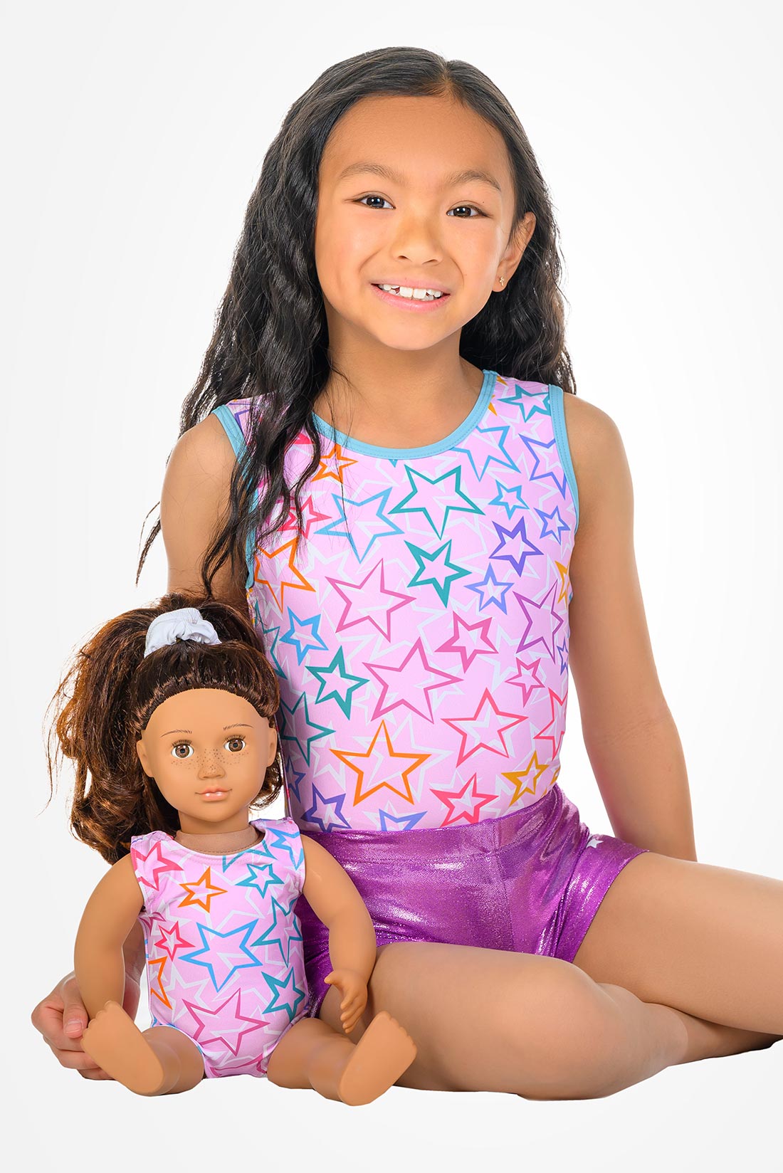Matching pink gymnastics outfits for girls and their dolls by Destira, 2026
