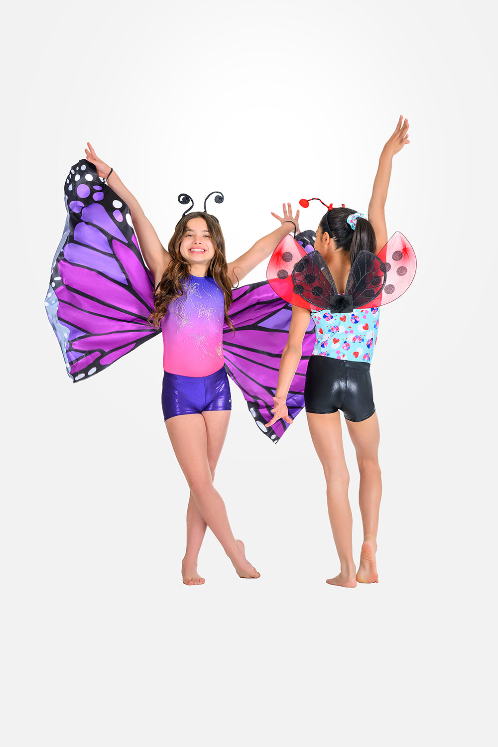 Two young girls modeling butterfly and ladybug costume sets with shorts made by Destira, 2026