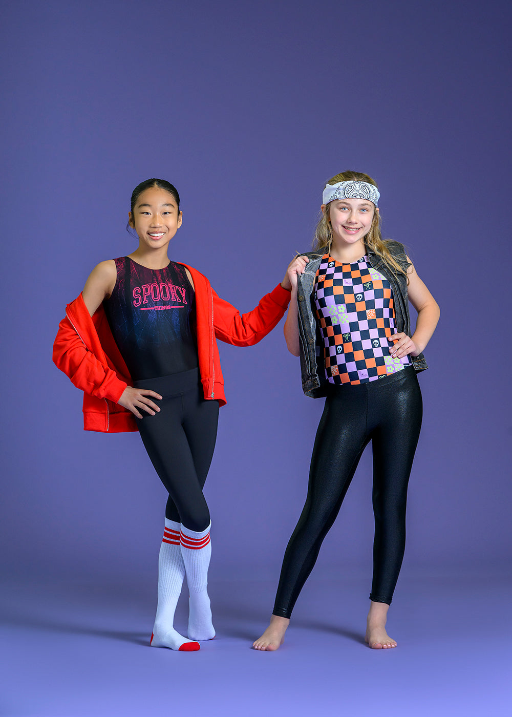 Two young dancers posing in athletic gymwear and leotards made by Destira. 2026