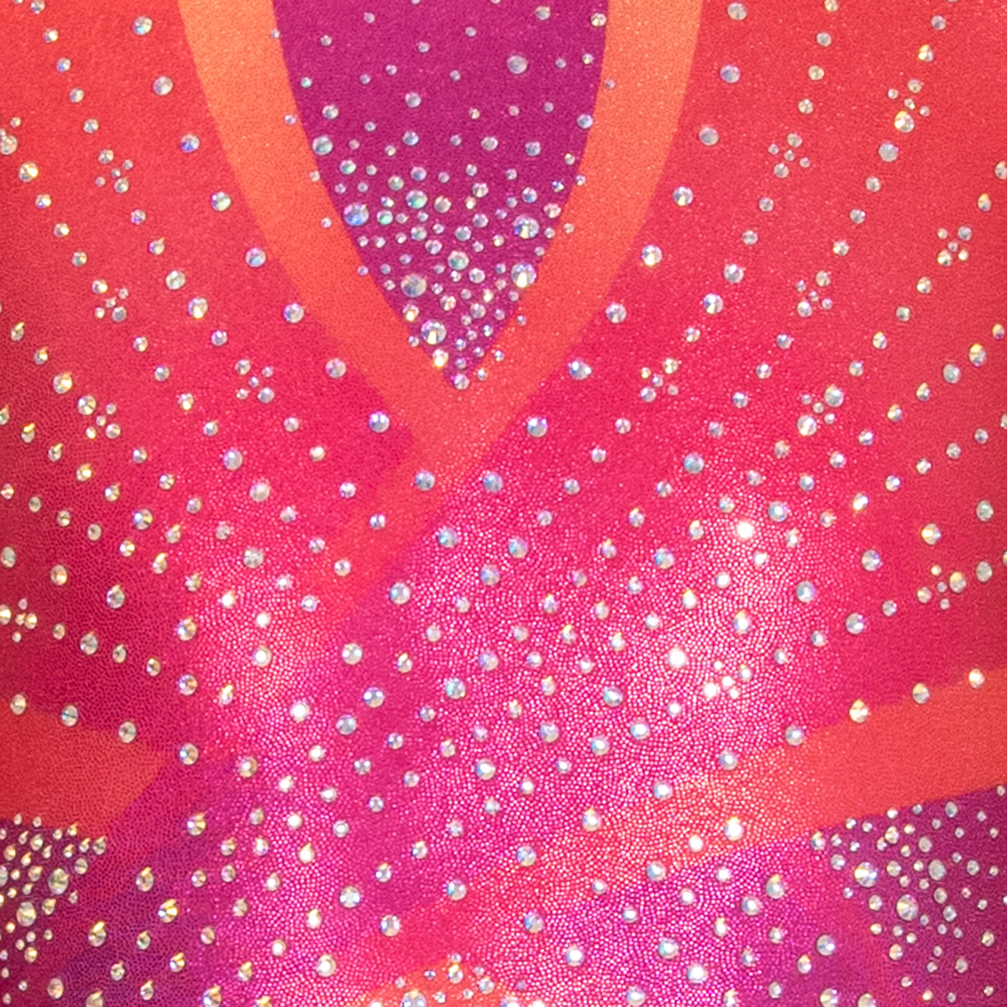 Close-up of a pink and orange custom embellished leotard by Destira, 2025