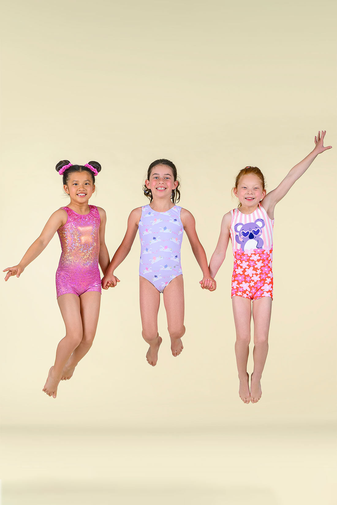 Pink and purple gymnastics outfits for girls by Destira, 2026
