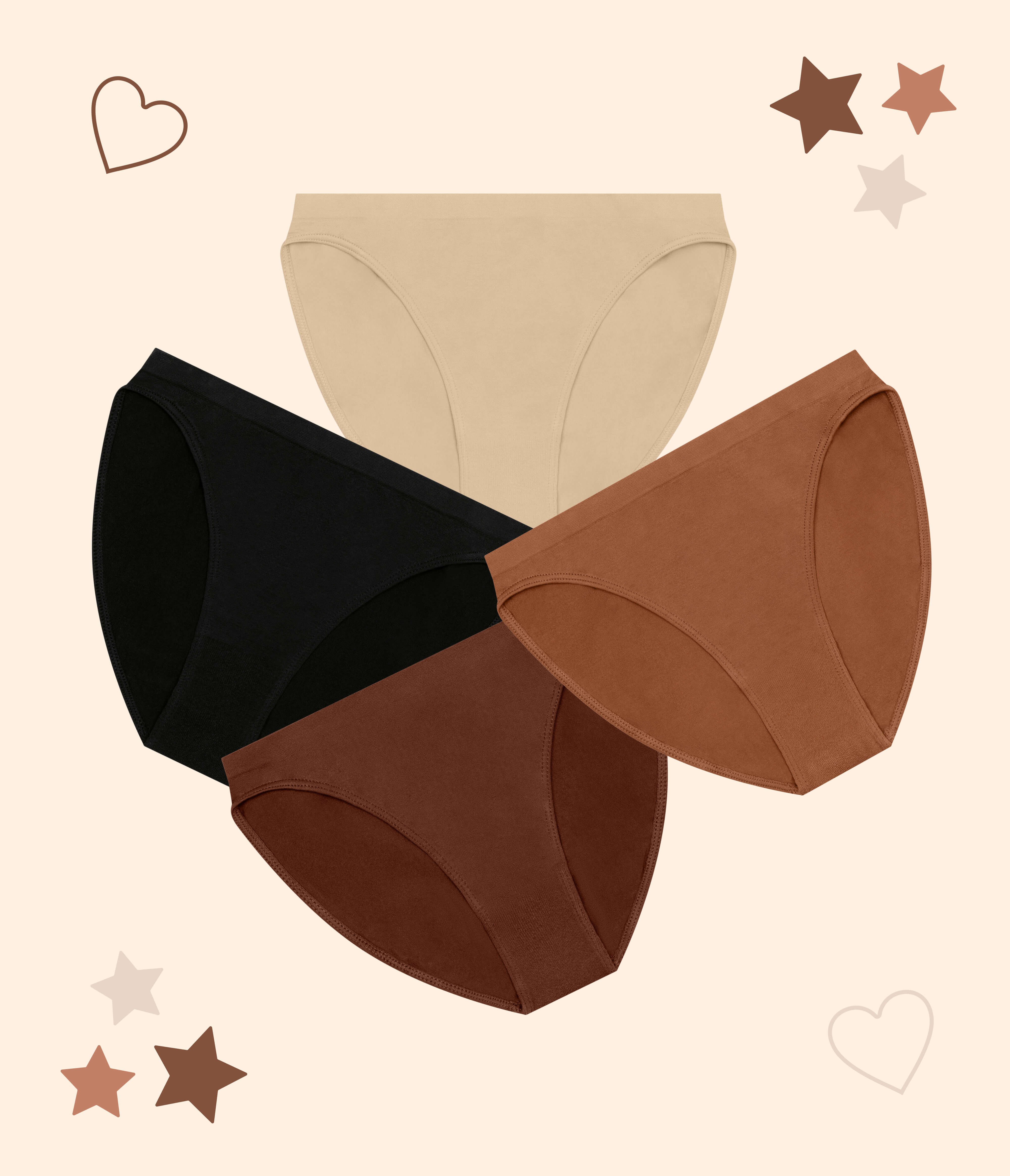 Four pairs of girls underwear arranged in a fan-like layout on a light cream background with decorative heart and star outlines.