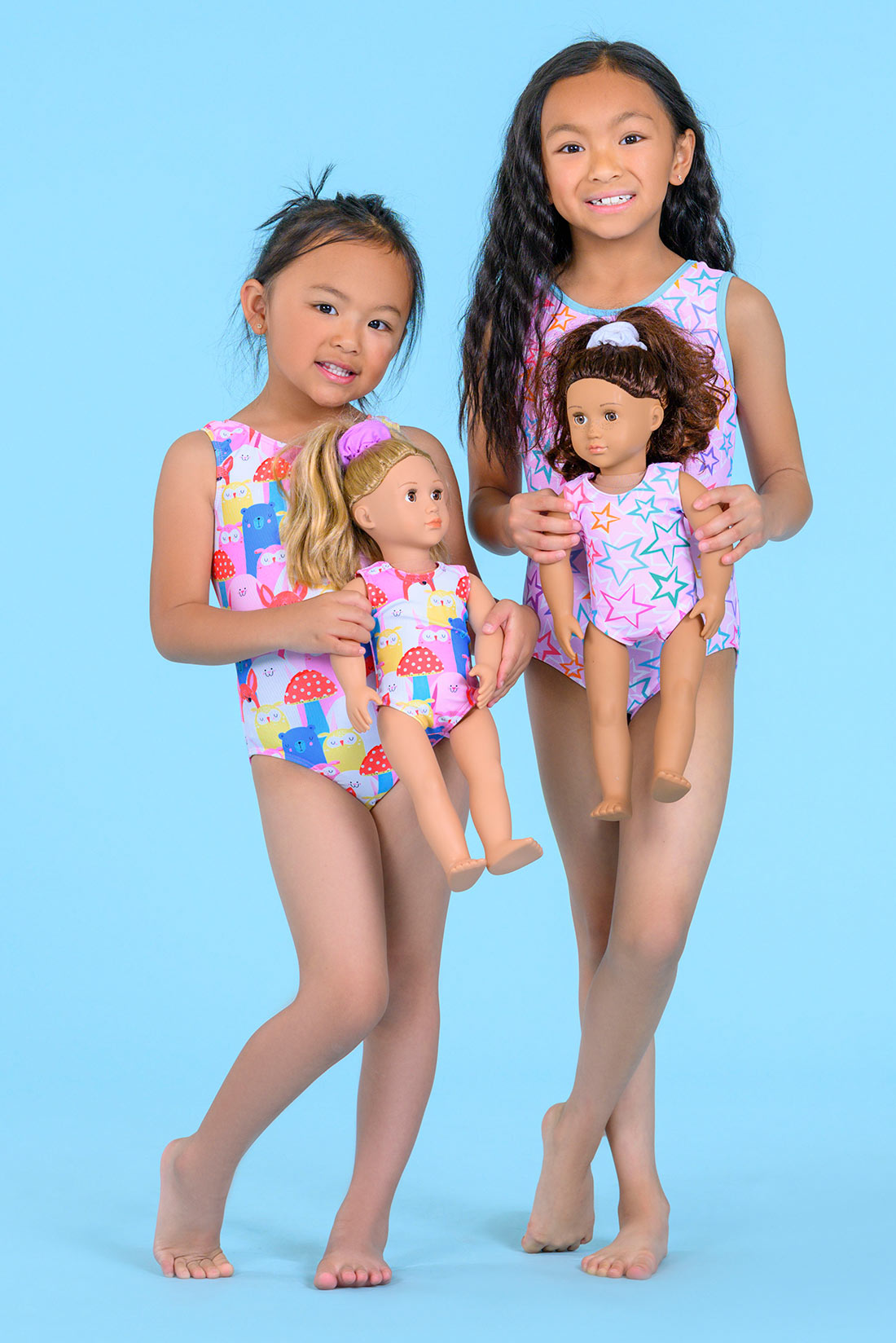 Girls with their dolls in matching leotards by Destira, 2026