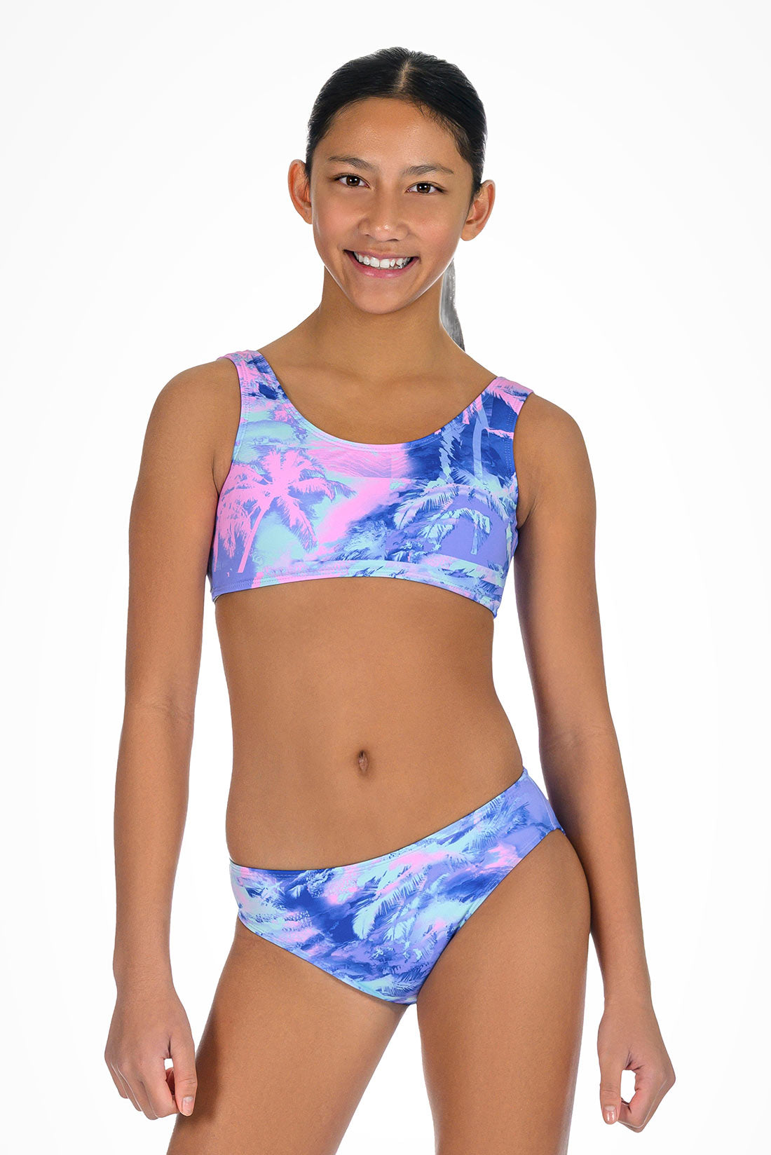 Girl wearing a colorful tie-dye bikini set on a white background showing front view